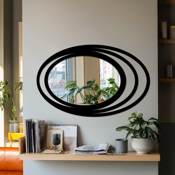 Displaying realistic detail, the Triple Halo Oval Wall Mirror presents a modern decorating with wall mirrors style through its layered frame in an interior setting.