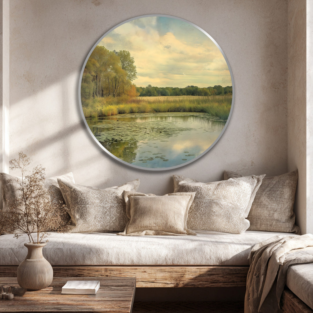 Foreground detail shows a rustic wooden table with a textured vase and book near an oil painting reproduction print featuring a tranquil landscape.