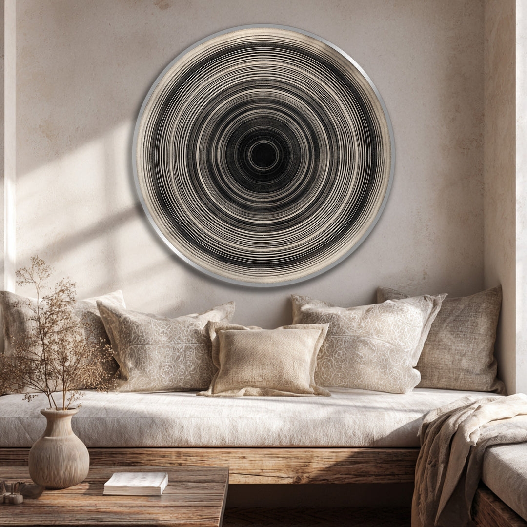 Warm light illuminates the round, minimalist 'Monochrome Pulse' oil painting decoration, showcasing concentric lines and a subtle, textured surface.