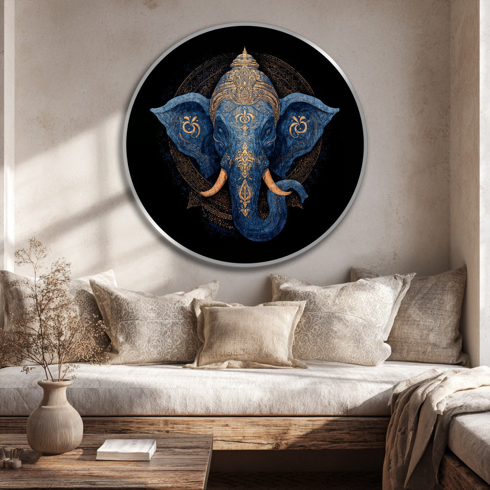 Subtle light and shadow play across the Divine Indigo Majesty, a modern oil painting art piece featuring a blue elephant with gold detailing in a round frame.