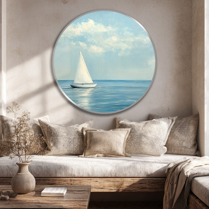 Layered depth is enhanced in this round oil painting artwork of a lone sailboat, where soft clouds meet the still, reflective sea.