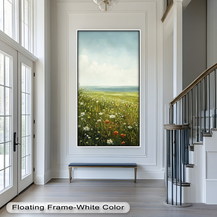 The daisies, poppies, and grasses sway gently in the breeze, adding charm and movement to this idyllic countryside scene.