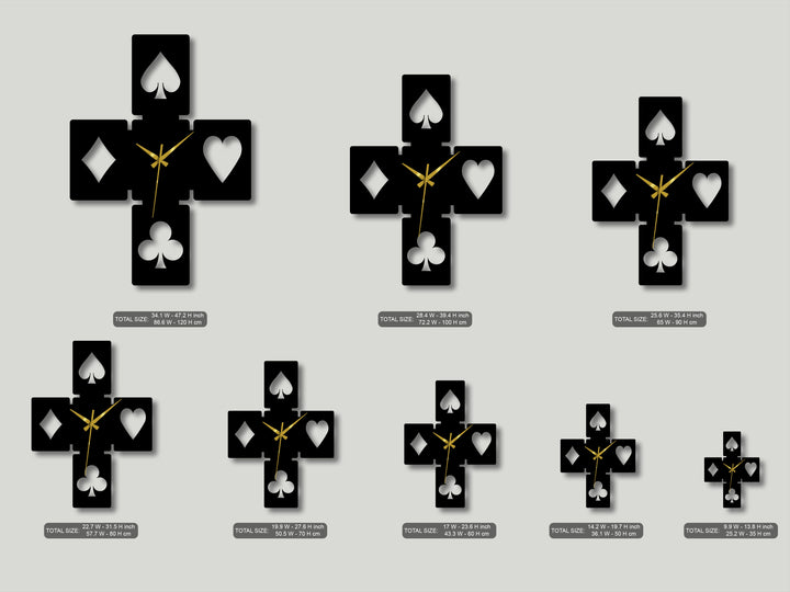 Vertical geometric cross-shaped metal artwork features stylized playing card symbols in varying sizes, acting as modern wall clocks.