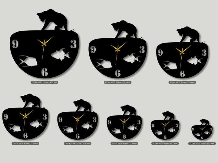 High color contrast defines the black cat and fish bowl metal art for wall clocks, with white numbers and gold hands on a light backdrop.