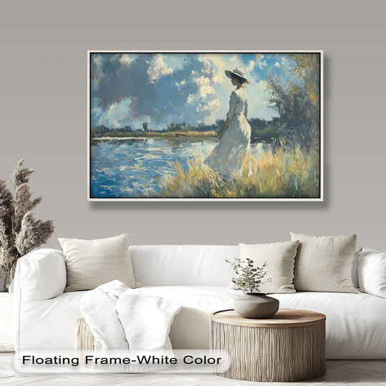 Impressionist oil painting art piece, 'Lady by the River,' showcases a woman in a white dress standing gracefully by the water's edge, framed by tall grass and a cloudy sky.