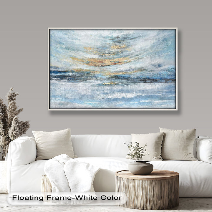 A serene abstract painting featuring soft blues, whites, and golden accents, evoking a tranquil seascape or misty horizon.