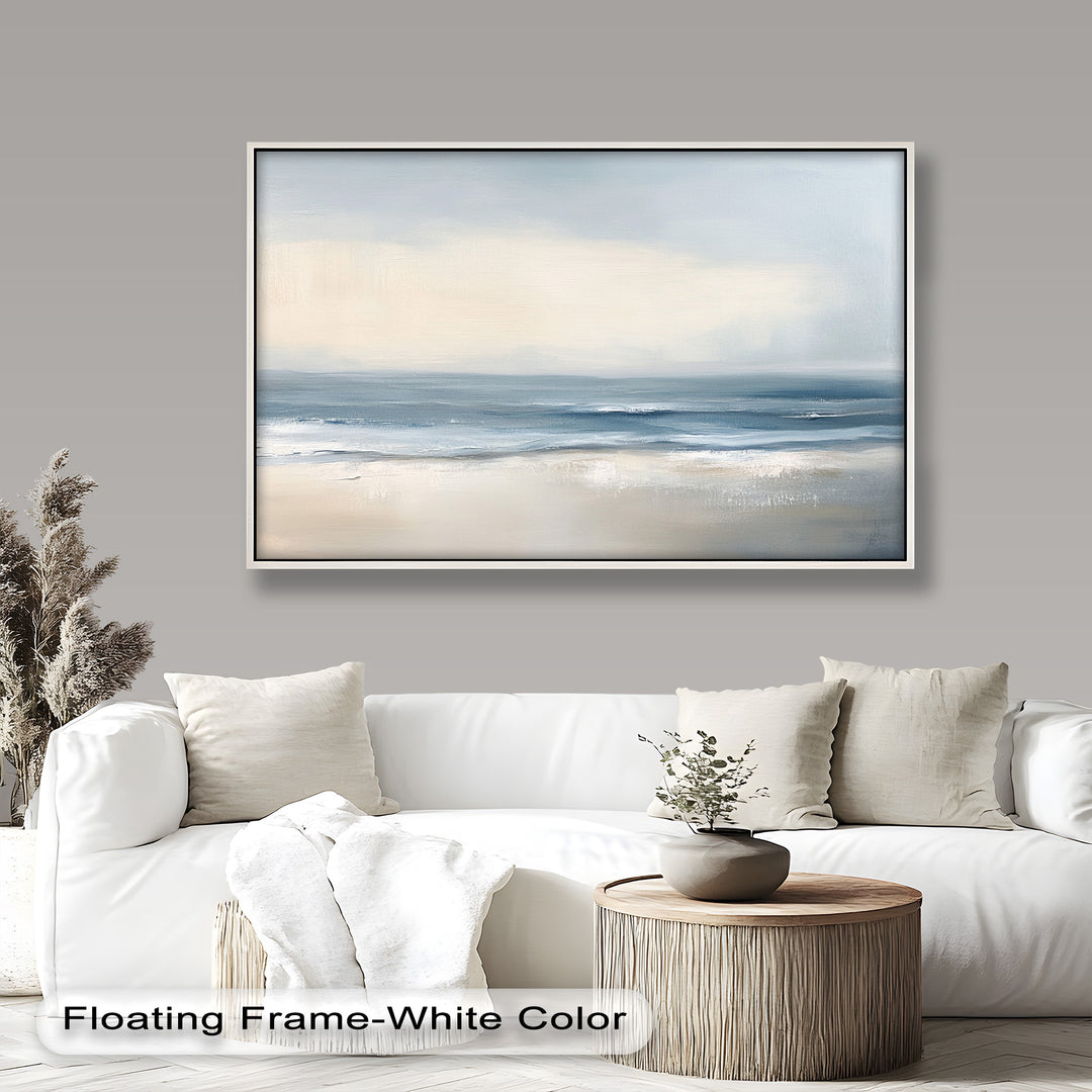 This minimalist seascape painting captures a peaceful shoreline with soft waves and gentle hues of blue, beige, and white blending into the horizon.

