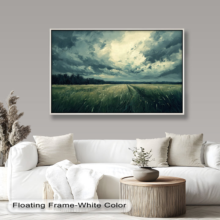 Dramatic stormy sky painting over a tranquil green meadow.
