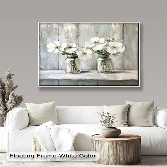 The abstract quality of this floral oil painting art piece highlights the serene beauty of white flowers in mason jars with textured, rustic brushstrokes.