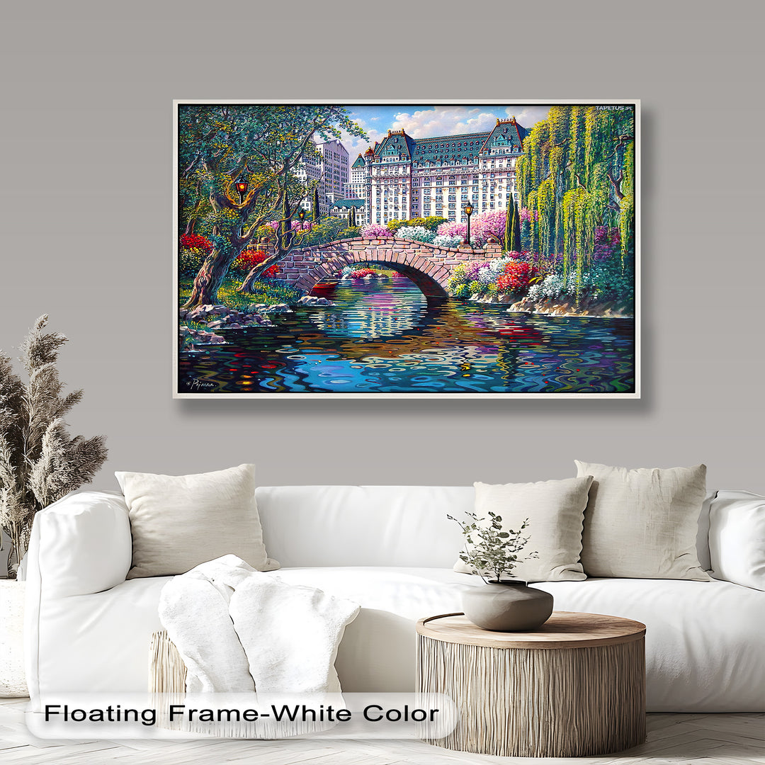 A vibrant cityscape painting featuring a picturesque stone bridge over a reflective river, surrounded by lush greenery and colorful flowers with a grand historic building in the background.
