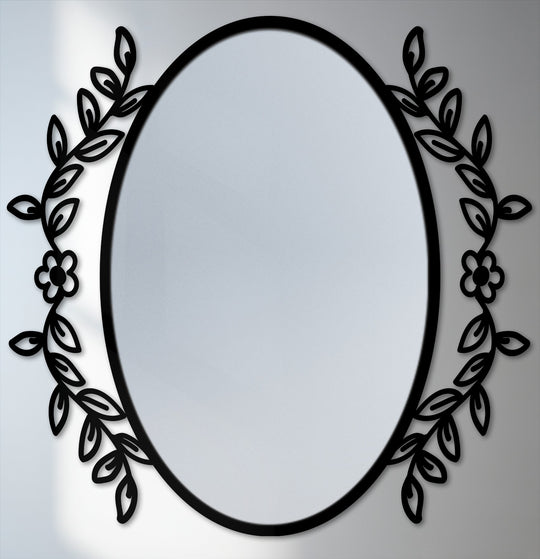 Featuring strong color contrast, a decorative botanical frame accentuates the central stained glass wall mirror surface within a unique metal wall art piece.