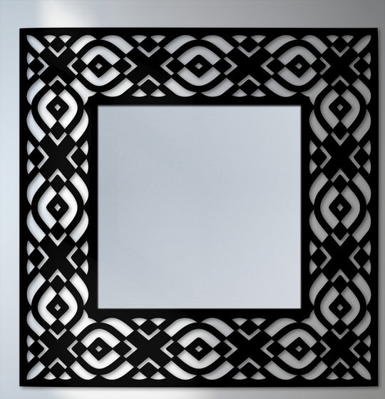 The focal point is the striking geometric tribal pattern frame surrounding this modern square floor decorative mirror, enhancing its visual appeal.
