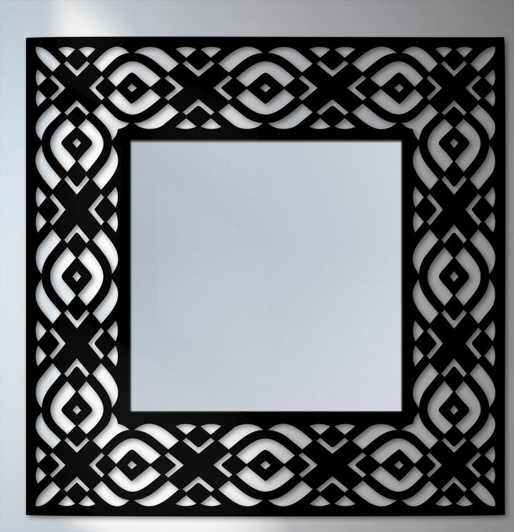 The focal point is the striking geometric tribal pattern frame surrounding this modern square floor decorative mirror, enhancing its visual appeal.