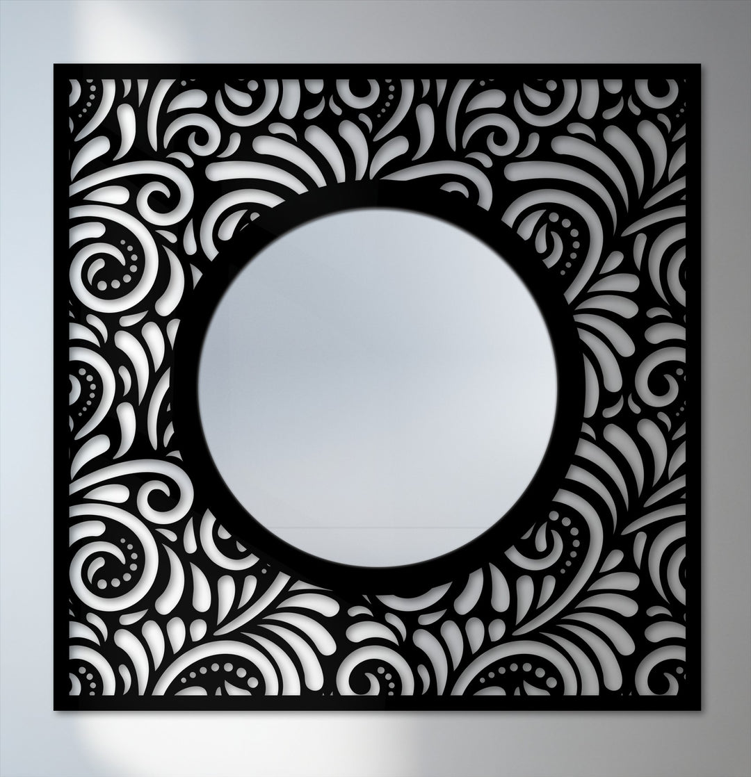 Negative space defines the ornate metal frame surrounding the mirror, creating a striking mirror for wall decor with its decorative black patterned design.