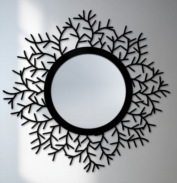 Background lighting highlights the decorative black metal botanical halo floor mirror as an impressive piece of metal artwork.