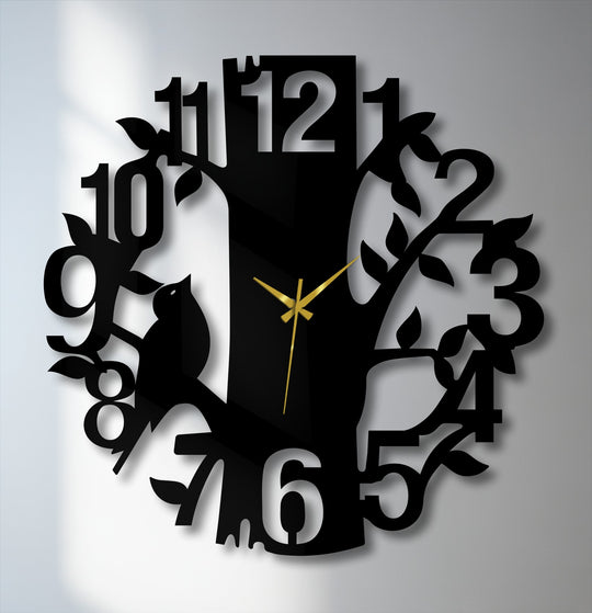 Black dominates this artistic nature-inspired tree-shaped metal wall decor clock, featuring numbers and a bird, creating a striking piece of metal wall decor.