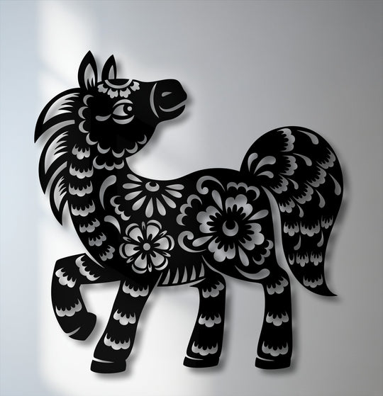 The foreground detail shows a charming floral pony silhouette, exquisitely crafted as decorative metal artwork with intricate cut-out patterns.