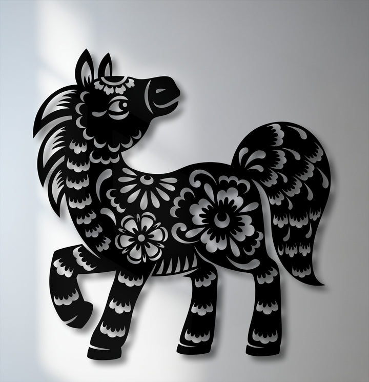The foreground detail shows a charming floral pony silhouette, exquisitely crafted as decorative metal artwork with intricate cut-out patterns.