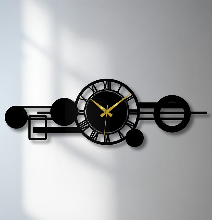 Black is the dominant color in this decorative metal art featuring a modern geometric metal wall clock with Roman numerals and an abstract orbit design.
