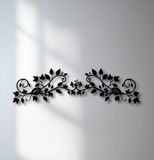 The striking black metal decoration wall art, an elegant floral vine with ornate botanical scrolls, creates a bold statement with its deep shadow.