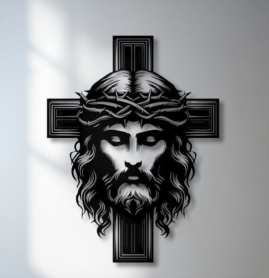The powerful black metal face of Jesus Christ with a crown of thorns is the central subject of this religious cross decoration wall art.