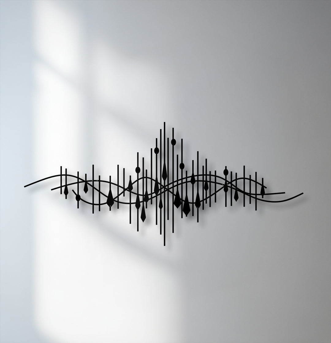 Low color saturation emphasizes the sleek black Abstract Soundwave Line Metal Wall Art, a striking decorative metal art against a muted, shadowed wall.