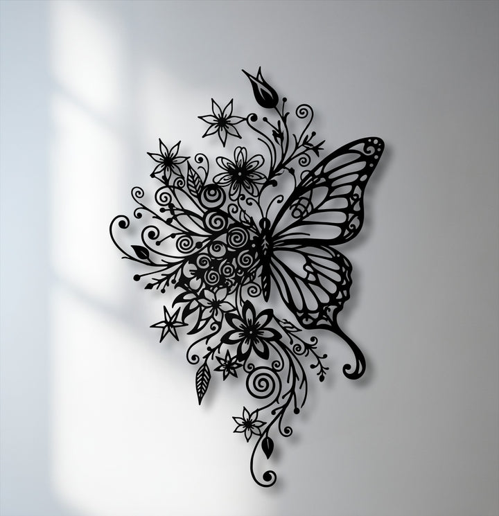 The intricate black butterfly and floral decorative metal art stands out in stunning elegance against a light background.