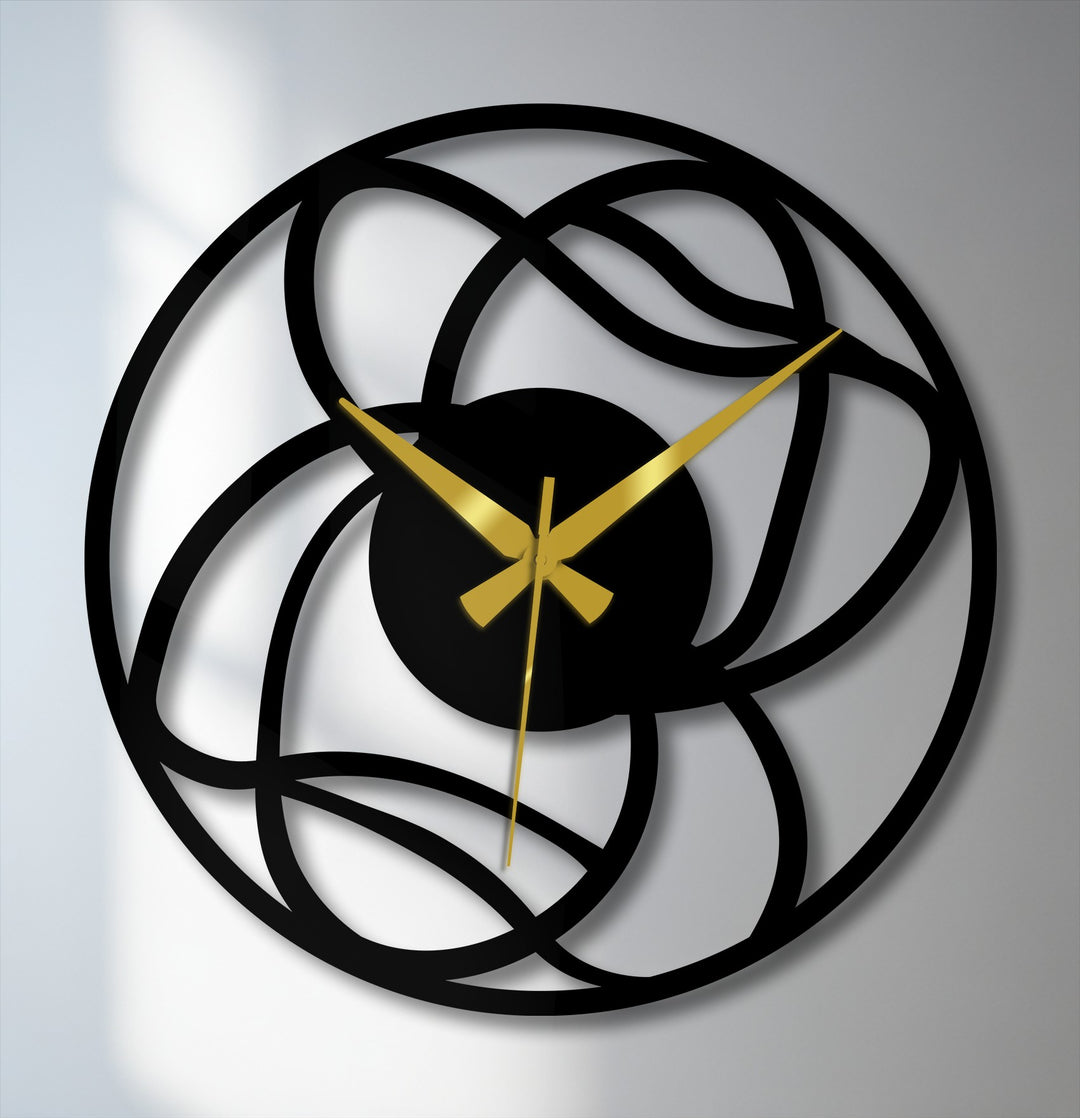 The interwoven design of this metal wall clock creates mesmerizing depth and layers, showcasing its decorative metal art.