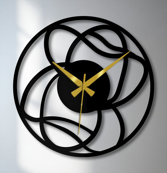 The interwoven design of this metal wall clock creates mesmerizing depth and layers, showcasing its decorative metal art.
