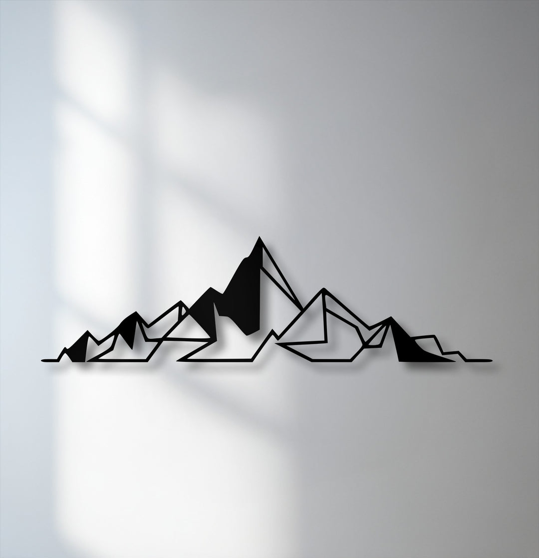 Against a light gray background, minimalist black metal art for wall depicts abstract geometric mountains with subtle shadows.