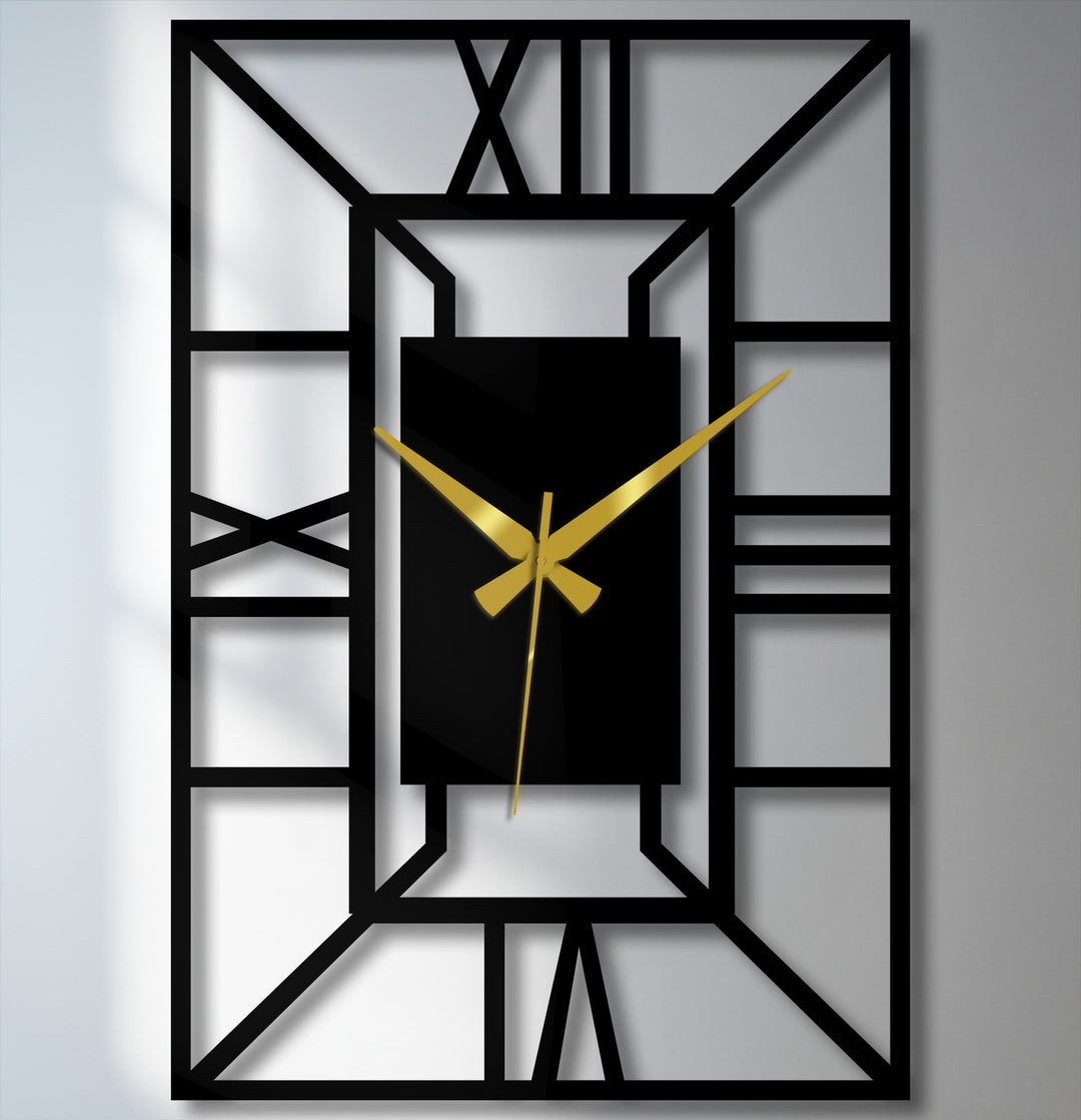 Black dominates this architectural frame geometric wall clock, a piece of metal wall decor with bold gold hands, casting shadows against a white backdrop.