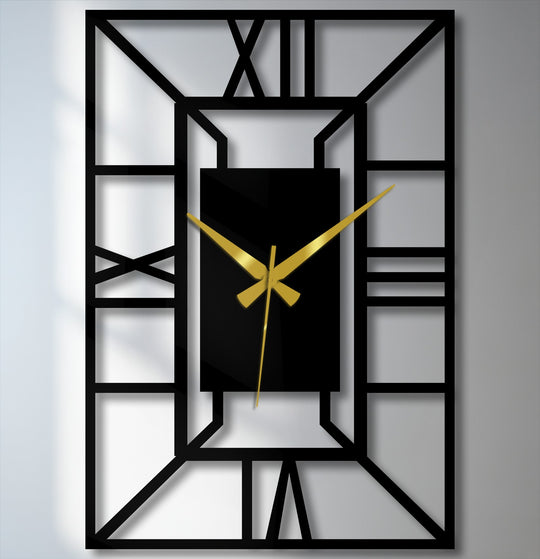 Black dominates this architectural frame geometric wall clock, a piece of metal wall decor with bold gold hands, casting shadows against a white backdrop.