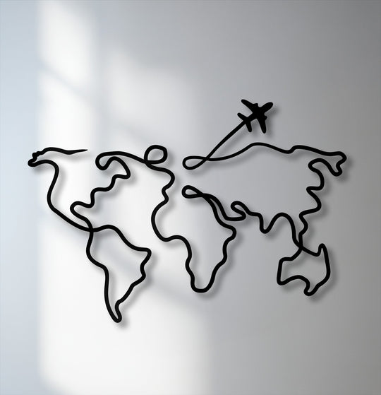 The focal point reveals a sleek black continuous line creating a minimalist world map and a silhouetted airplane, stunning decorative metal art.