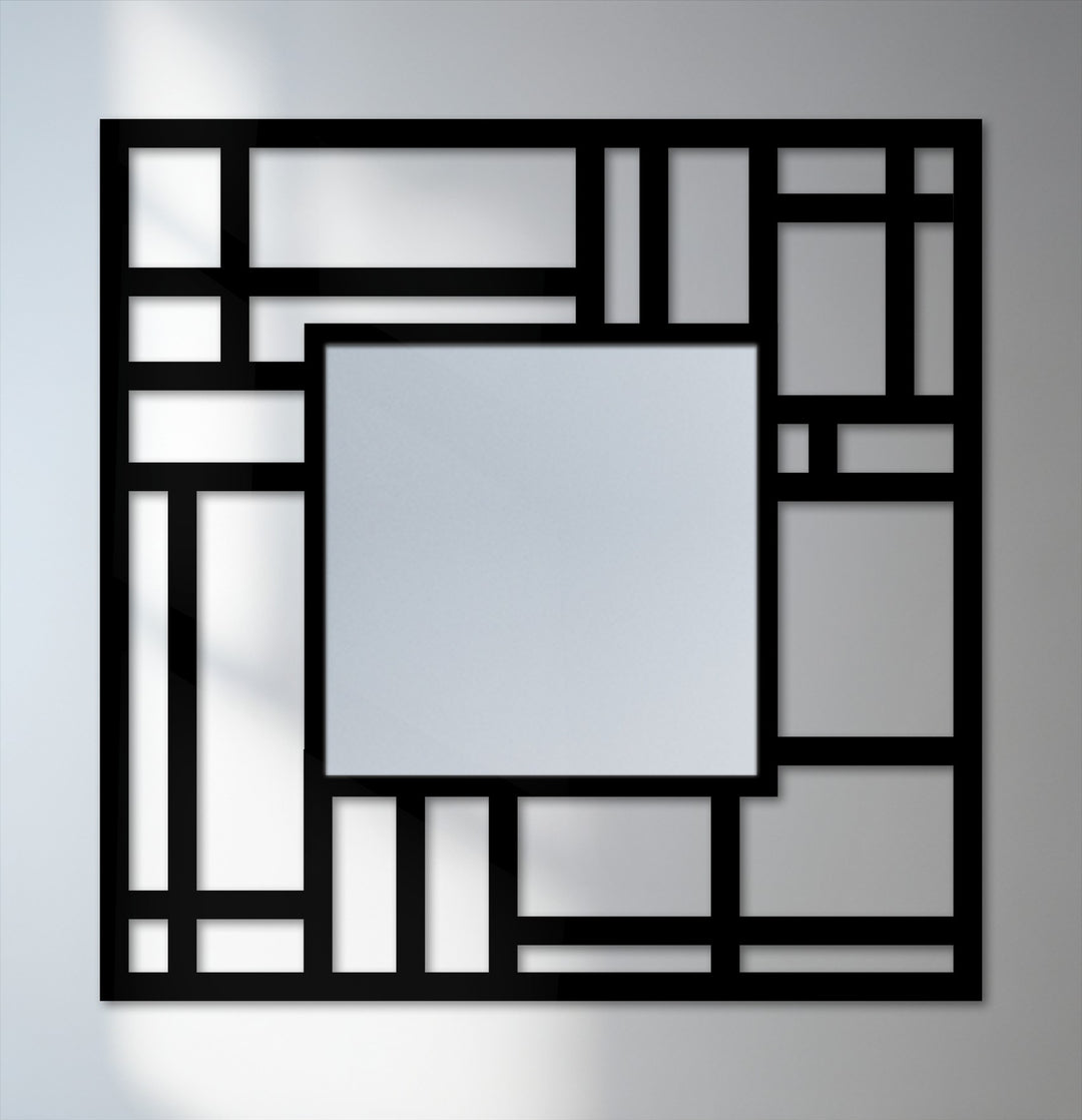 The darkest area showcases the bold, black geometric grid defining this modern metal artwork, highlighting the reflective bathroom mirror nestled within the structured design.