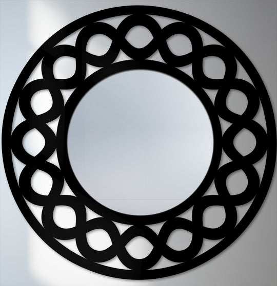 The brightest area reflects light around this infinity loop round decorative wall mirror, making it a modern mirror for wall decor.