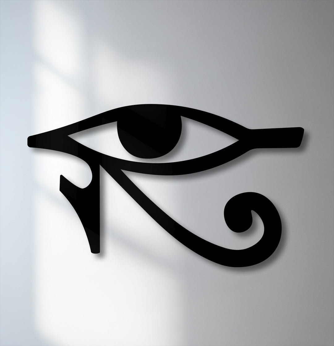The geometric elements of the black Eye of Horus symbol form striking lines and curves in this ancient Egyptian metal wall decor.