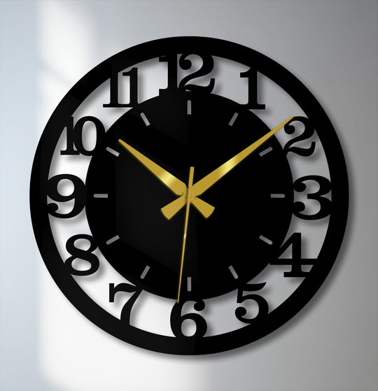 Defined by its crisp edges, this black modern metal wall clock features bold numbered cutouts, offering a striking border in this decorative metal art piece.