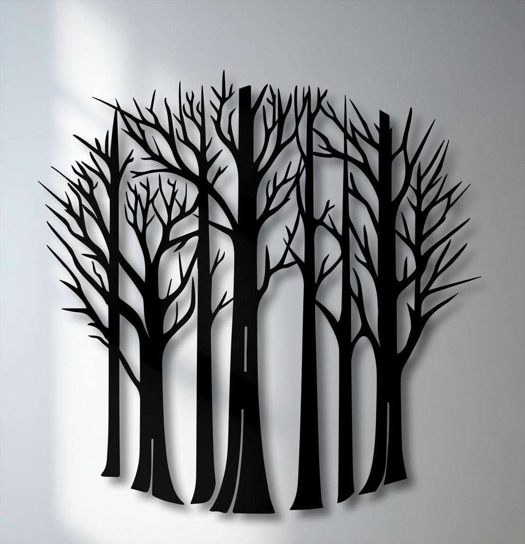 The striking silhouette of interconnected bare forest trees forms a captivating piece of metal wall decor, casting soft shadows.