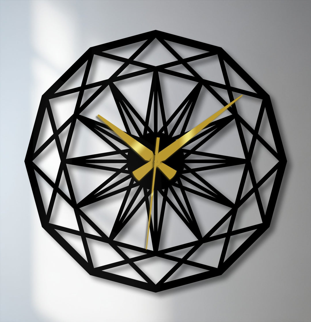Central geometric star pattern features golden hands on this striking metal wall decor clock, a modern statement piece.