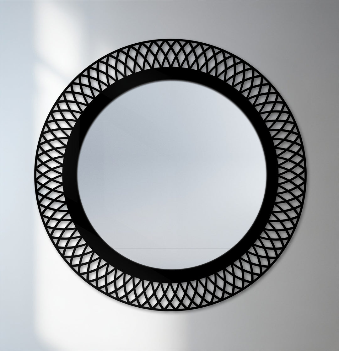 Layered depth is created in this geometric lattice round framed wall mirror with its ornate black metal frame adding dimension and visual interest.