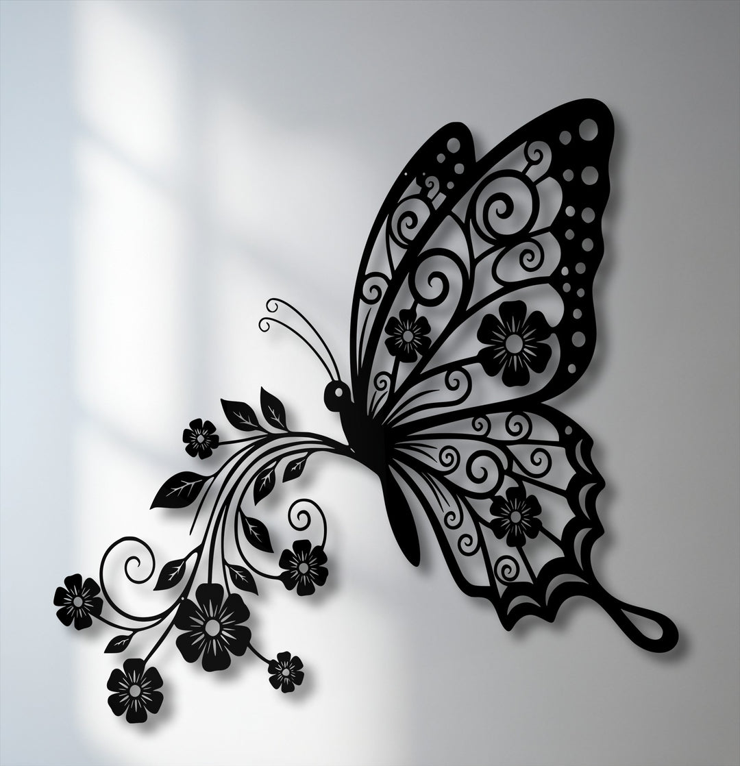 The luminous white wall area softly highlights the intricate floral wings of the black butterfly metal decoration wall art.