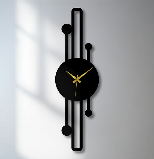 High color contrast emphasizes the black and gold details of this vertical minimalist metal artwork wall clock with its geometric lines.