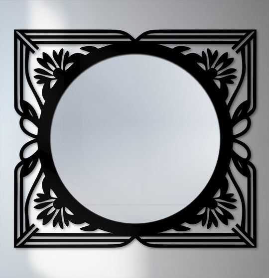 Organic floral flourishes frame the reflective surface of this framed wall mirror, offering an elegant, art deco statement with its intricate black metal artwork.