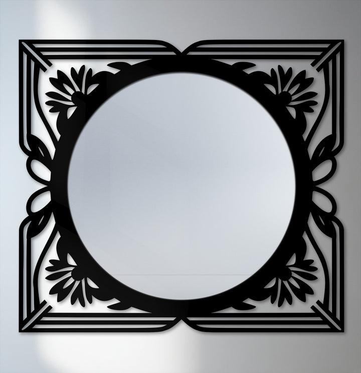 Organic floral flourishes frame the reflective surface of this framed wall mirror, offering an elegant, art deco statement with its intricate black metal artwork.
