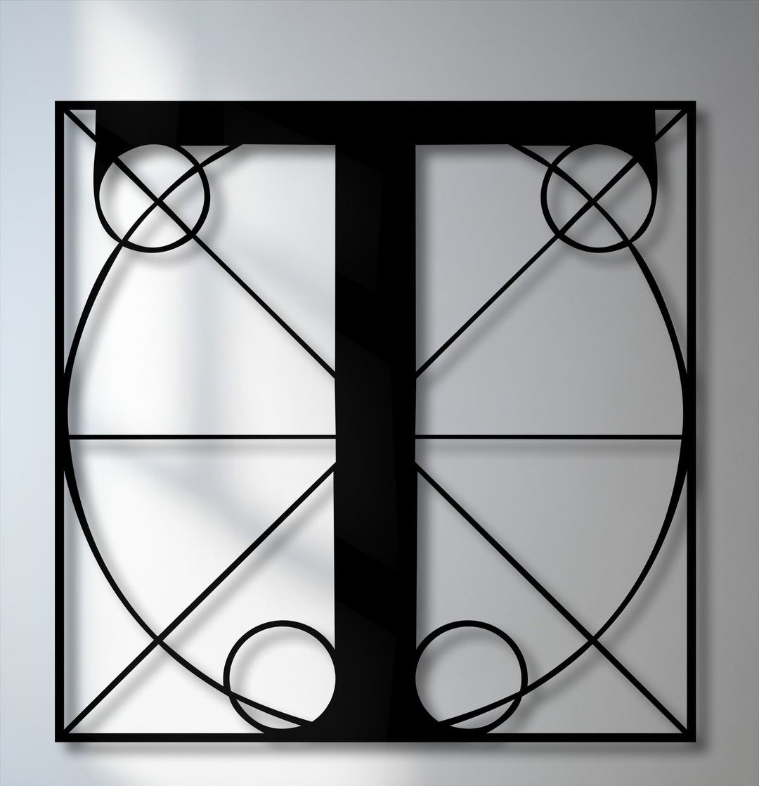 Geometric elements of intersecting lines, circles, and elegant curves define this sleek black Letter T metal art for wall with a modern monogram.