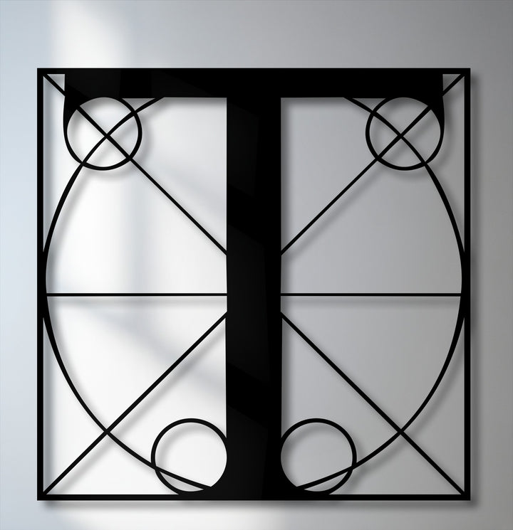 Geometric elements of intersecting lines, circles, and elegant curves define this sleek black Letter T metal art for wall with a modern monogram.
