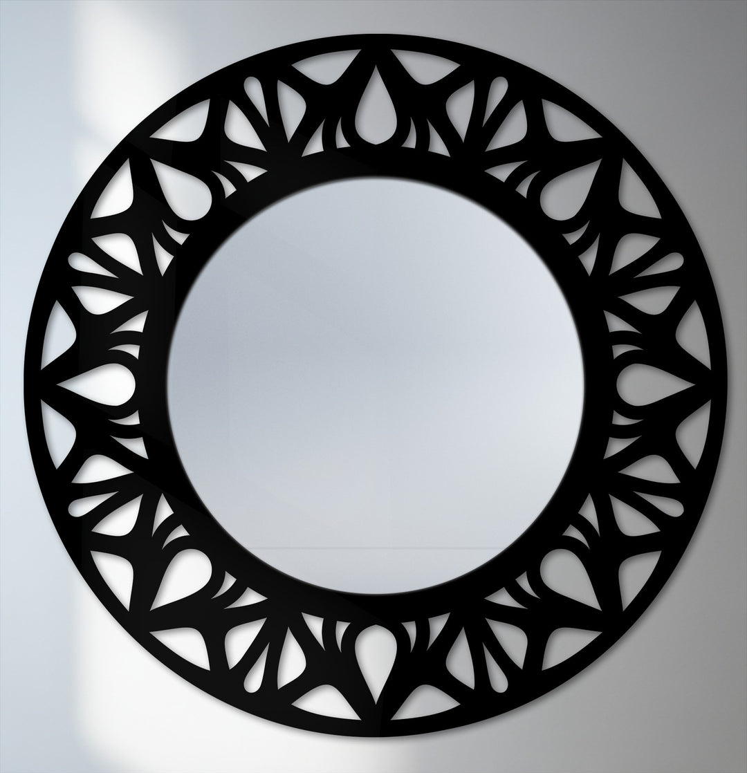 Foreground intricate floral cutouts encircle this modern black metal framed decorative mirror, creating a unique statement piece for home decoration wall art.