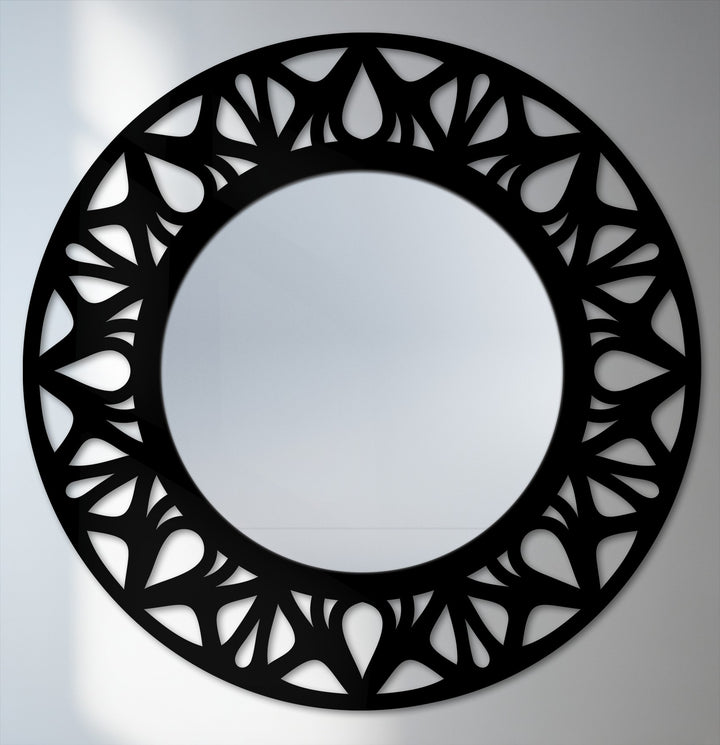Foreground intricate floral cutouts encircle this modern black metal framed decorative mirror, creating a unique statement piece for home decoration wall art.