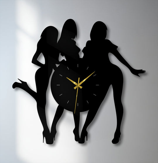 Flowing figures in this unique metal wall art clock strike dynamic poses, creating an illusion of motion and adding a bold design statement.
