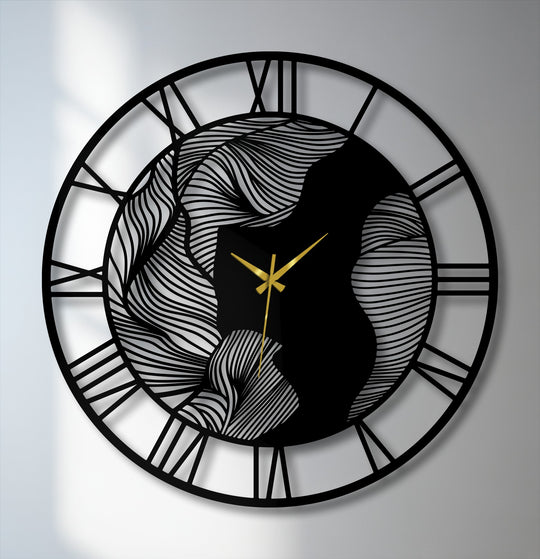 Smooth, undulating lines of decorative wall art create an abstract wave design in this modern metal wall clock featuring elegant Roman numerals and gold hands.